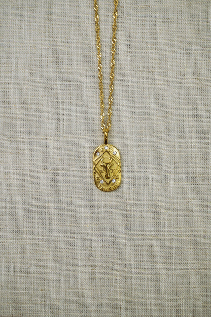 Gold thin dainty necklace with a taurus zodiac pendant