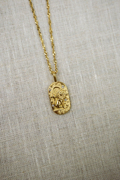 Gold necklace with a leo zodiac pendant