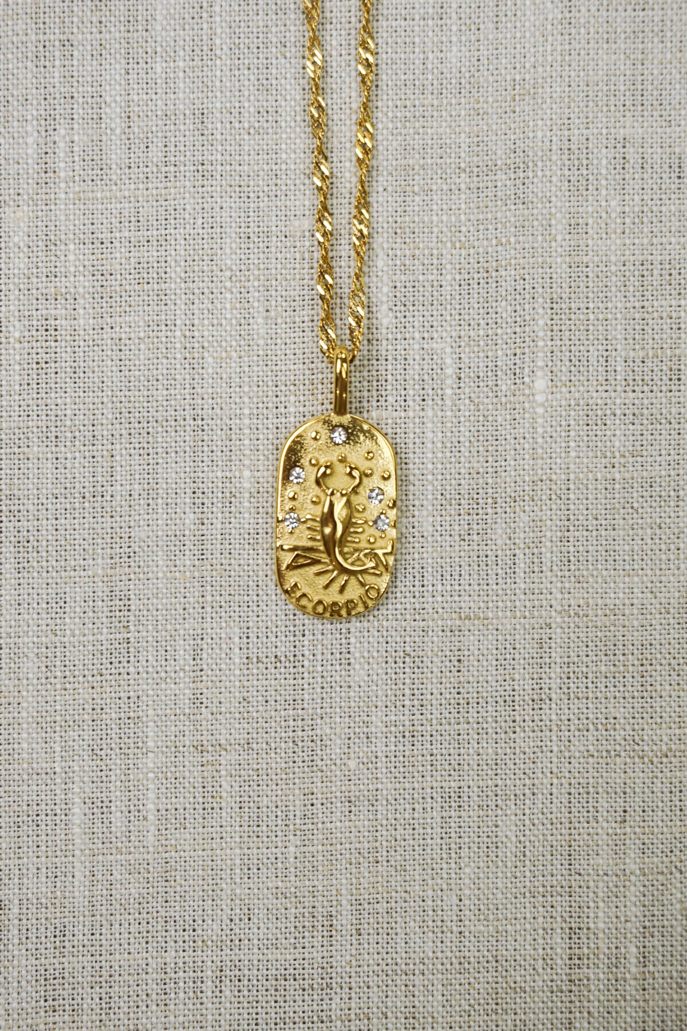 Gold thin dainty necklace with a scorpio zodiac pendant