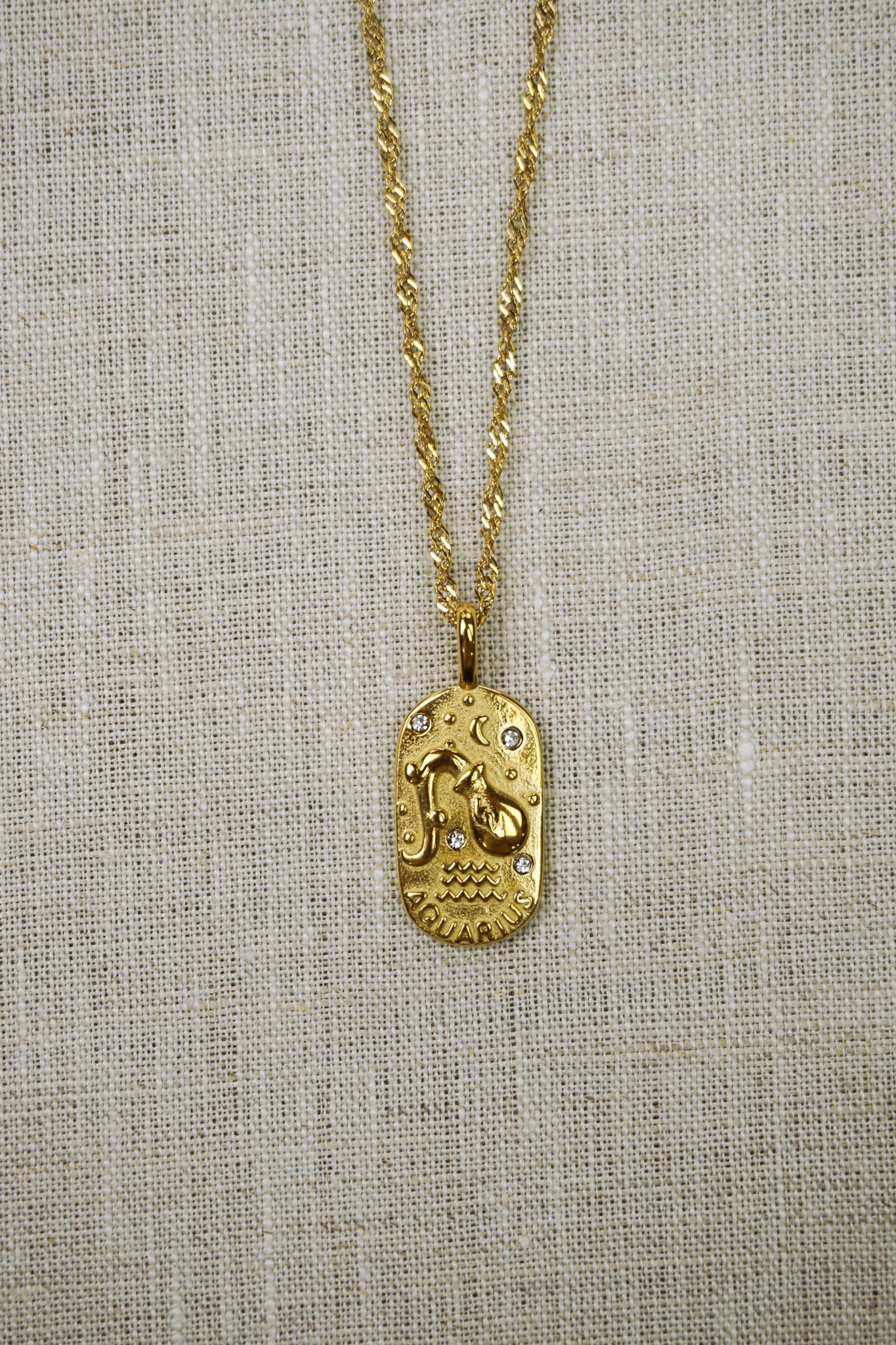 Gold thin dainty necklace with an aquarius zodiac pendant