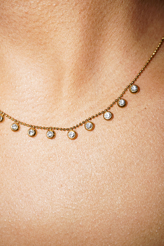 Necklace with small diamonds on a person's neck