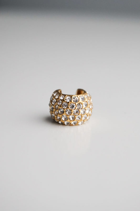 Gold cuff with embedded stones pavé diamonds