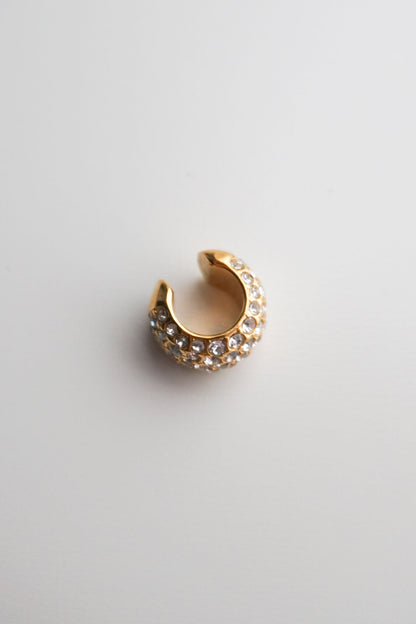 Gold cuff with embedded stones pavé diamonds