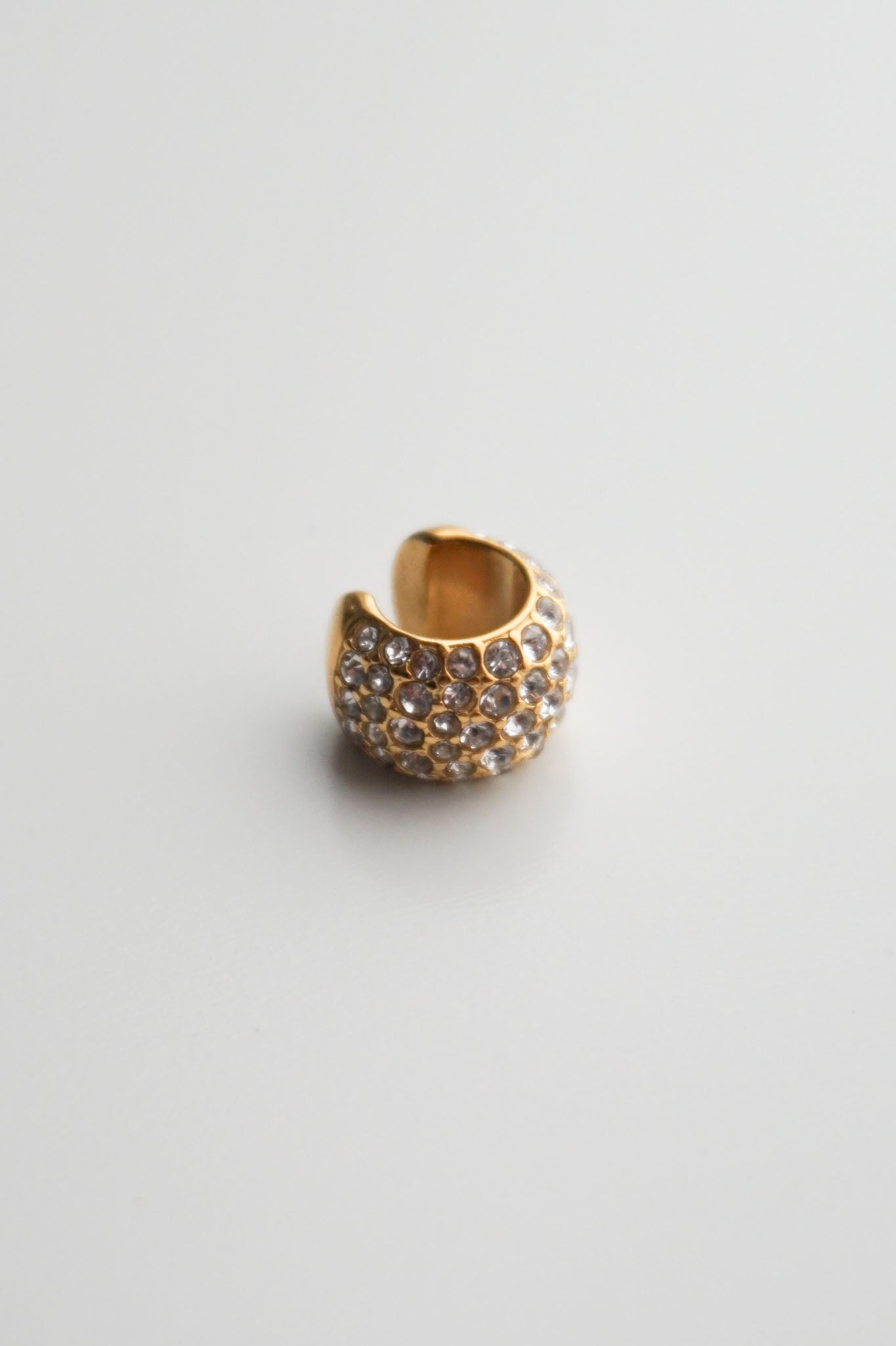 Gold cuff with embedded stones pavé diamonds