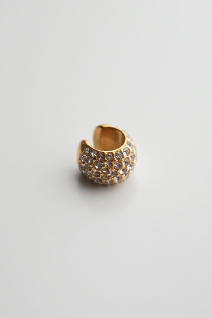 Gold cuff with embedded stones pavé diamonds