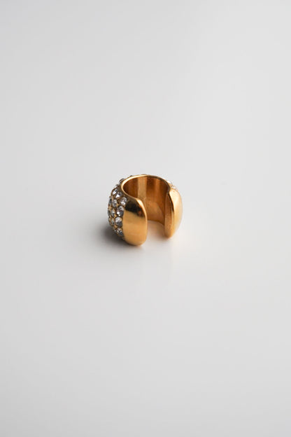 Gold cuff with embedded stones pavé diamonds