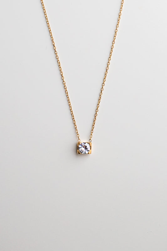 Gold necklace with a small diamond pendant